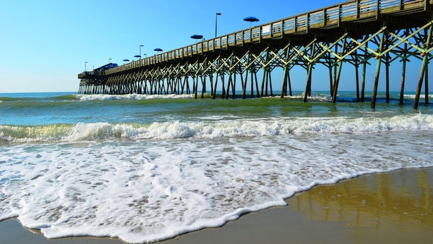 A pier extending into the ocean with a clear sky above. - Murrells Inlet Escape-2B, close to Marshwalk, elevator, pool (Murrells Inlet)