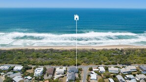 An aerial view of a coastal residential area with houses, a beach, and the ocean. - Blairgowrie 5 Peregian Beach (PEREGIAN BEACH)