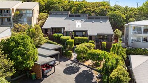 A residential area with a house featuring a tiled roof, a covered patio, and a driveway. - Martin's Patch Unit 2 Peregian Beach (Peregian Beach)