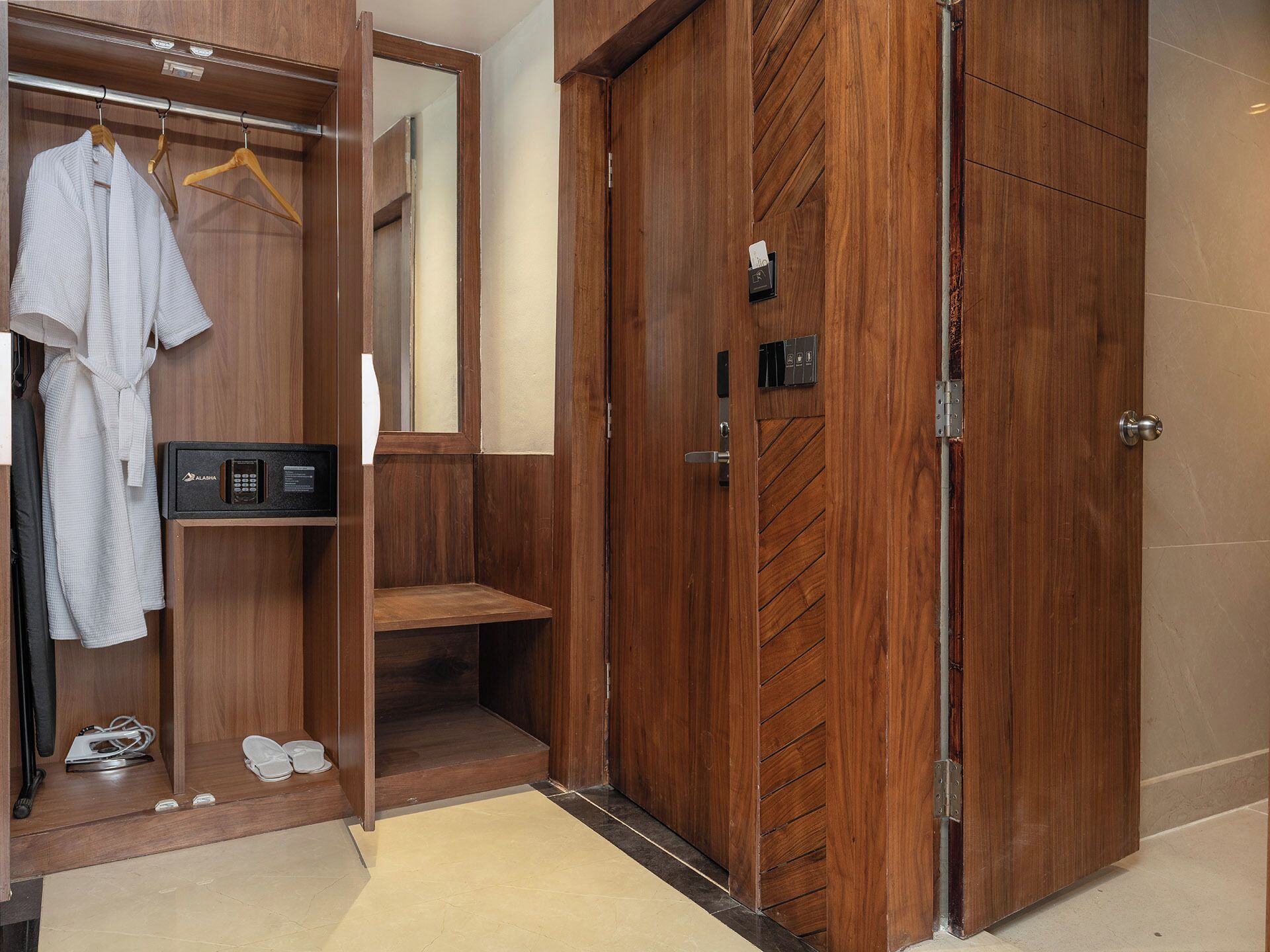 A wooden wardrobe with a mirror, a hanging rack, and a built-in shoe rack.