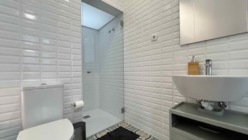 Family Room, City View | Bathroom | Shower, hair dryer, towels, soap