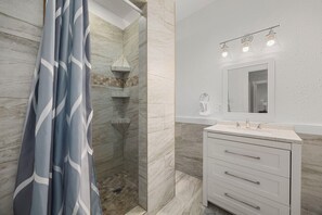 Shower, hair dryer, towels, soap