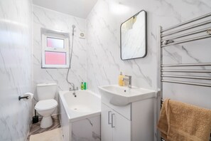 Shower, hair dryer, towels, soap