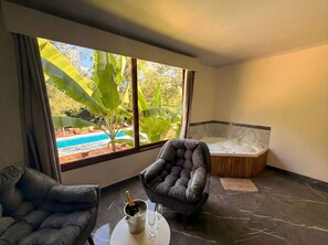 Suite Deluxe, vista piscina | Wi-Fi gratuito