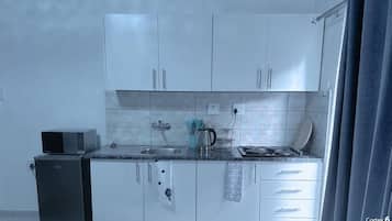 Family Apartment, 1 Bedroom, Kitchen, Garden View | Private kitchen | Mini-fridge, microwave, stovetop, cookware/dishes/utensils