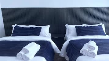 Family Apartment, 1 Bedroom, Kitchen, Garden View | Desk, laptop workspace, blackout drapes, iron/ironing board