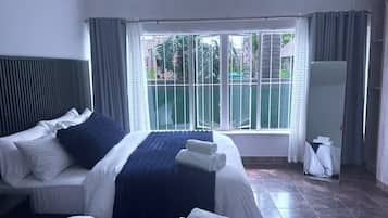 Apartemen Keluarga, 1 kamar tidur, dapur, pemandangan kebun | Seprai katun Mesir, seprai premium, selimut bulu angsa, dan busa memori