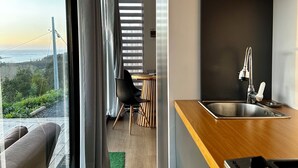 A modern kitchen with a wooden countertop and stainless steel sink. - pro estancia 1 (constitución)