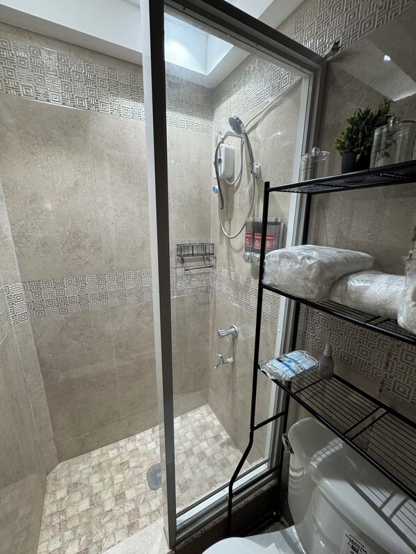 Shower, hair dryer, towels, soap
