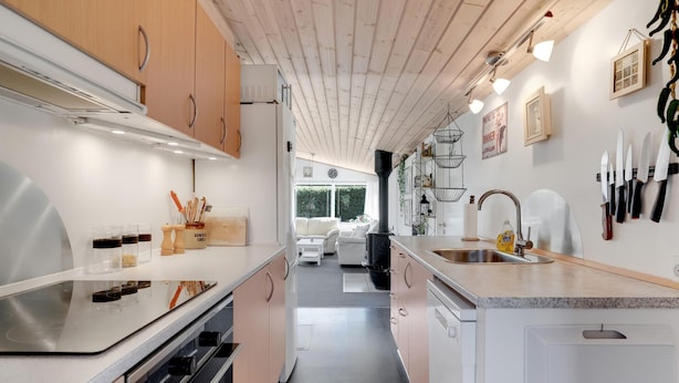 A modern kitchen with a central island, stainless steel appliances, and a view to the living area. - Stunning home in Sydals with WiFi (Sydals)