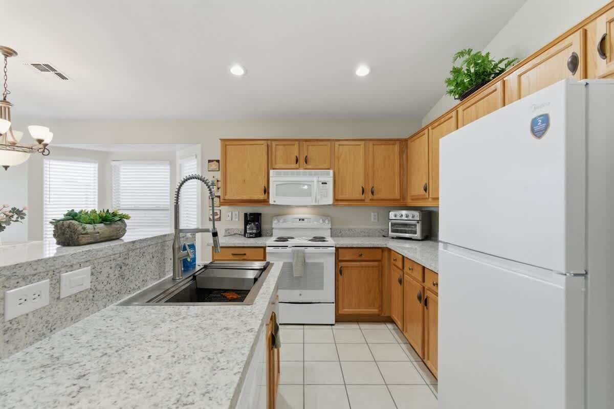 Fridge, stovetop, cookware/dishes/utensils