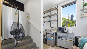 Una cocina compacta con lavavajillas integrado, microondas y una pequeña encimera.