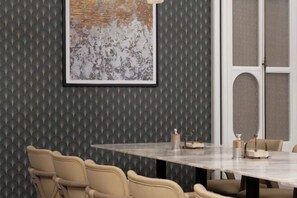 A conference room with a large table, beige chairs, and a textured wall. - Meilun Hotel, Baymax Center, Dongting, Wuxi (Wuxi)