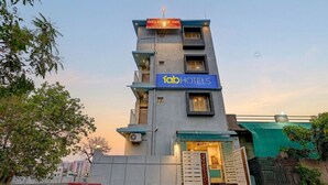 A multi-story building with a sign for 'fabHOTELS' and a 'WELCOME IN' sign above the entrance. - Fabhotel Welcome Inn Besa (Nagpur)
