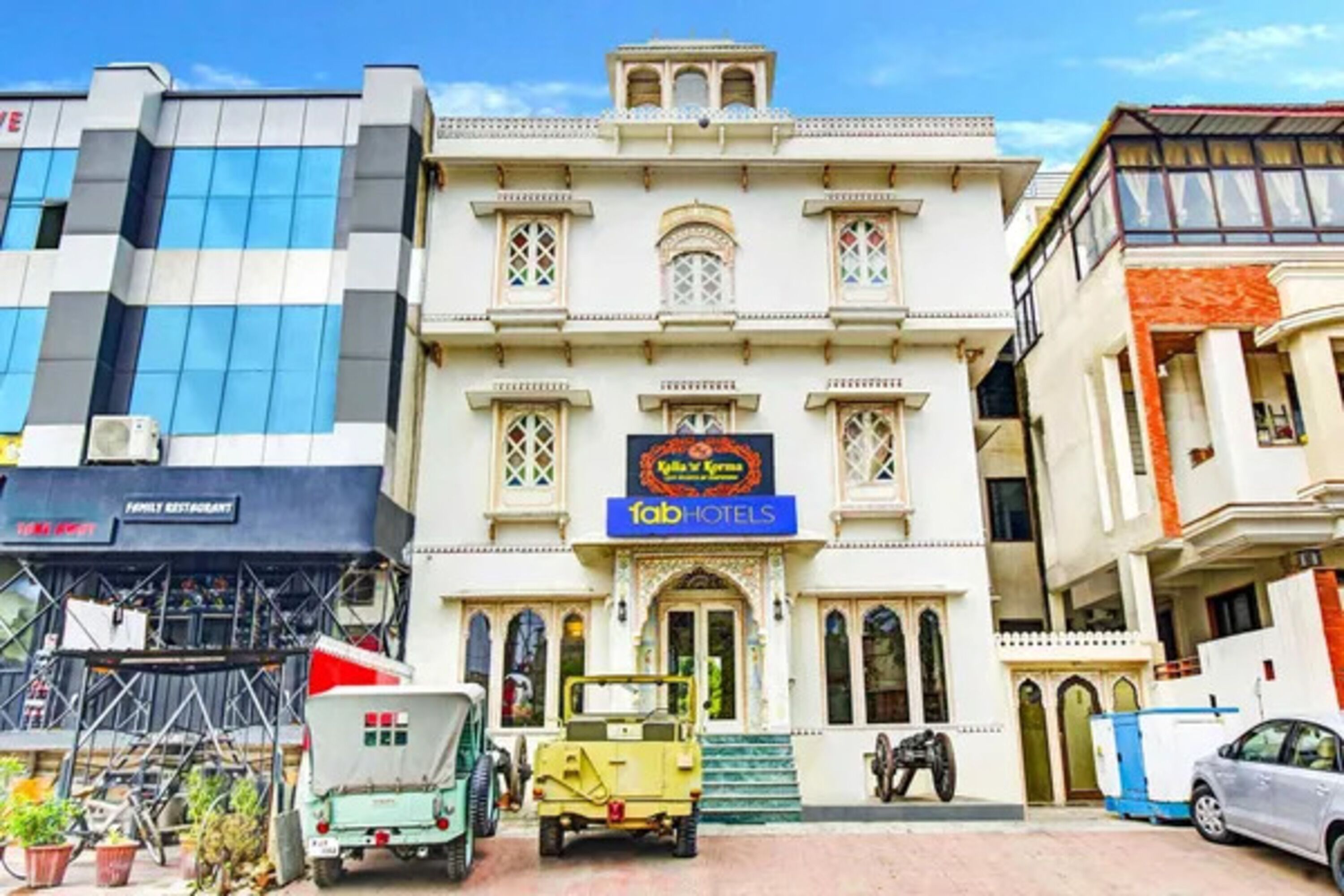 A building with a sign for 'Tab Hotels' and a sign for 'Kali's Spa'.