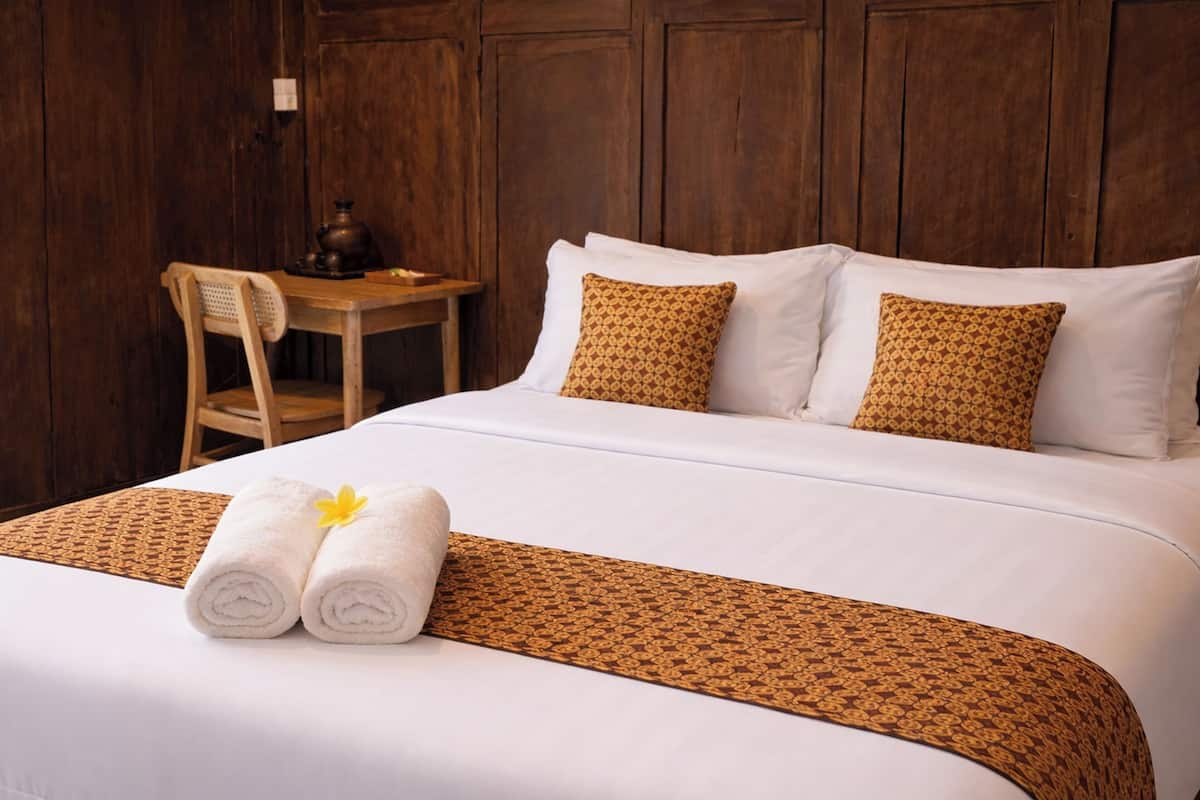 Desk, laptop workspace, bed sheets