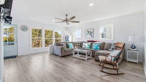 A spacious living room with a large ceiling fan, two sofas, a rocking chair, and a coffee table. - "Once in a Blue Moon - 796 OBW" 4 Bedroom, Second Row (Supply)