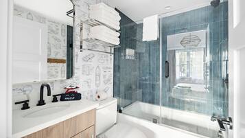 Shower, hair dryer, towels, toilet paper