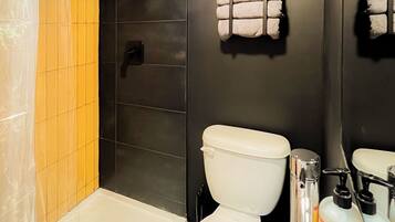 Shower, towels, soap, toilet paper