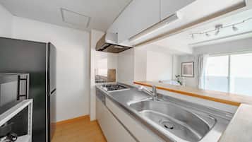 Apartment | Private kitchen | Fridge, microwave, stovetop, highchair