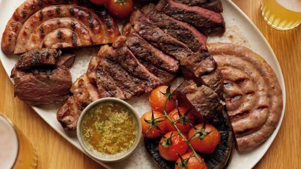 A plate of grilled meats and vegetables. - Bishopstrow Hotel and Spa - Small Luxury Hotels of the World (Bishopstrow)