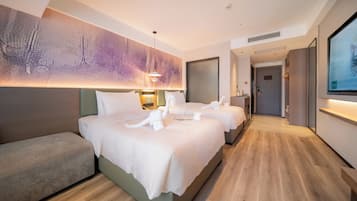 Quarto duplo superior | Frigobar (abastecido com itens grátis), cortinas blackout