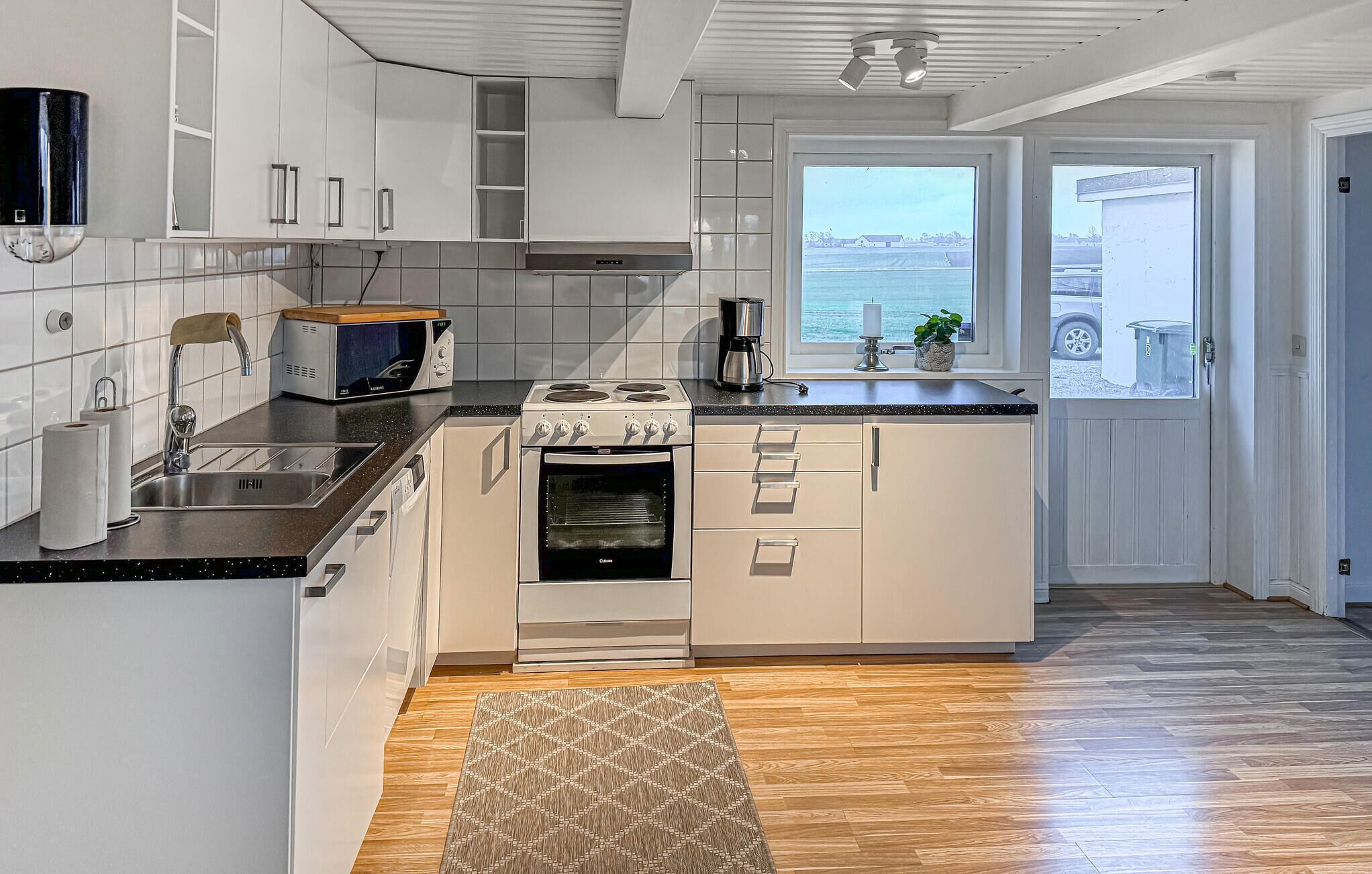 Fridge, stovetop, dishwasher, coffee/tea maker