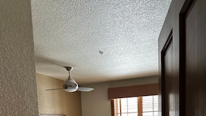 A hotel room with two beds, a ceiling fan, a window with blinds, and a door. - 2-bedroom Hyatt Main Street Station - Peak 9 in Breckenridge with Mountain View (Breckenridge)