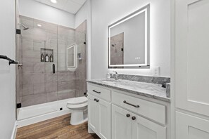 Shower, hair dryer, towels, soap