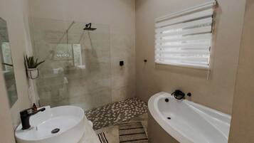 Shower, hair dryer, towels, toilet paper