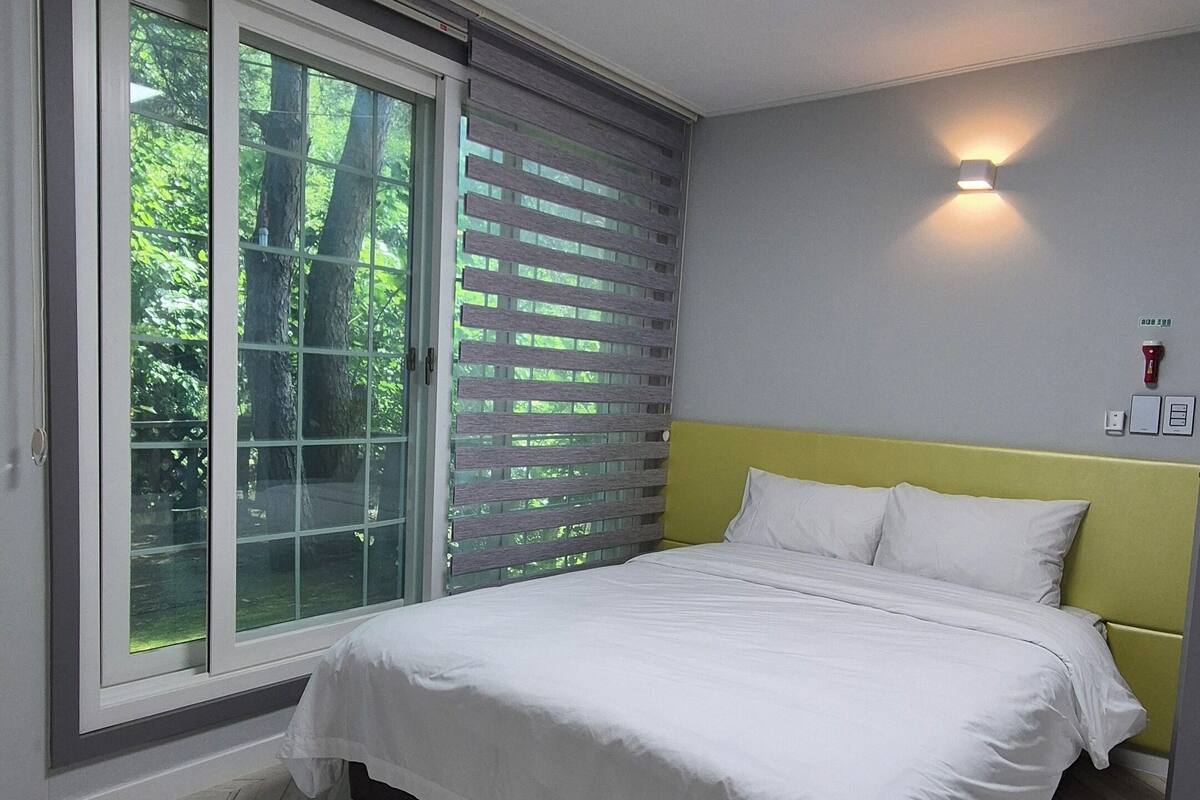 Family Suite, 2 Bedrooms, Kitchen, Garden View | Blackout drapes, iron/ironing board, free WiFi
