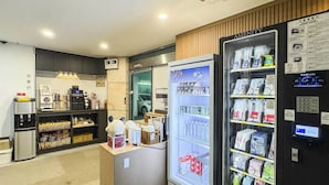 A hotel lobby with a vending machine, a coffee machine, and a refrigerator stocked with beverages and snacks. - Hotel Boribat SeokNam (Incheon)