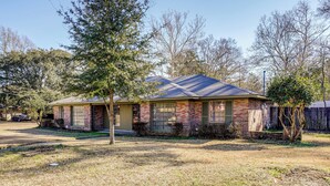 A single-story house with a brick facade and a gabled roof. - Family Home w/ Yard - 5 Mi to Jackson State Campus (Jackson)