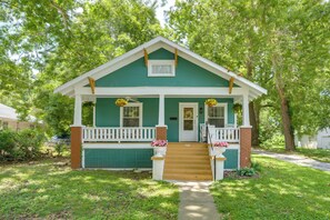 A green house with a white porch, a front door, and a small front yard. - < 1 Mi to MSU! Updated Springfield House w/ Deck (Springfield)