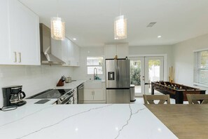 Fridge, microwave, oven, stovetop - Stylish 3BR Home • Heated Pool • Garage • St Pete (St. Petersburg)