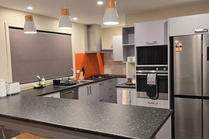 Fridge, microwave, oven, stovetop - Stylish 3 bedroom home in Palmerston North (West End, Palmerston North)
