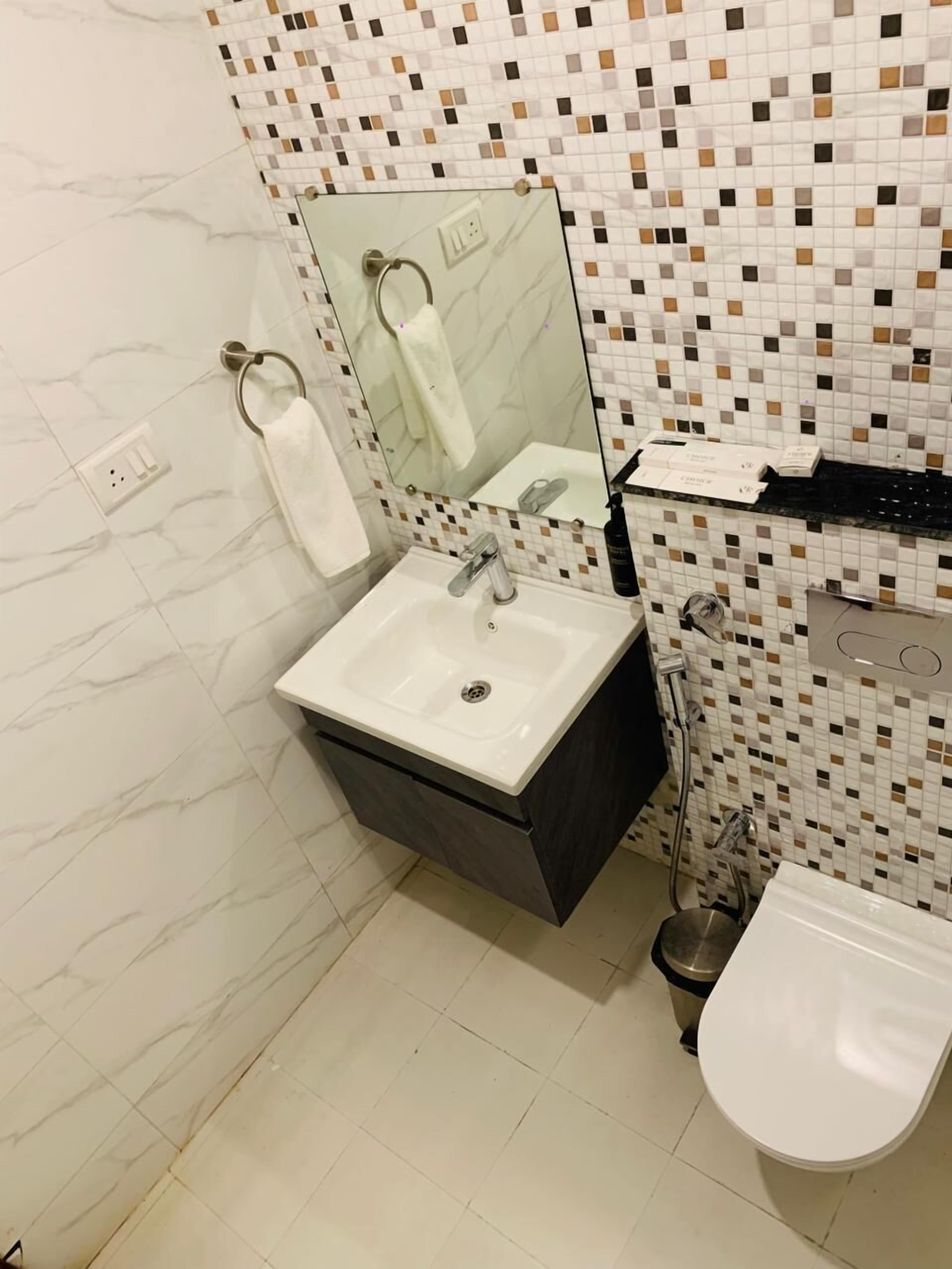 Shower, slippers, towels, soap