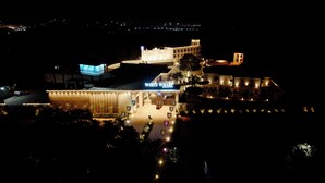 A large building with a sign reading 'WHITE WHARF RESORT.' - White Wharf Manesar (Gurugram)