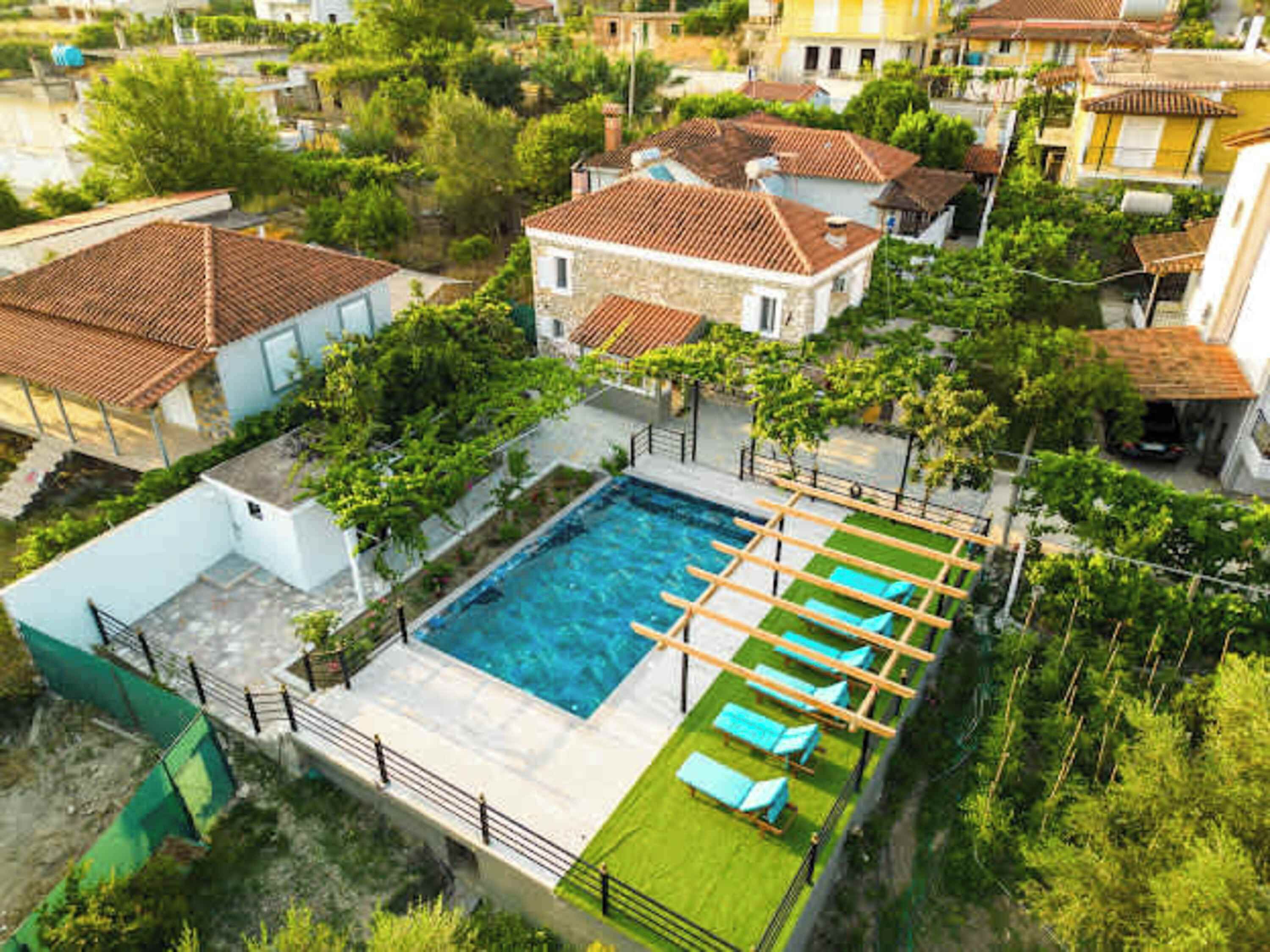 Aerial view showing the layout of the property and shared pool