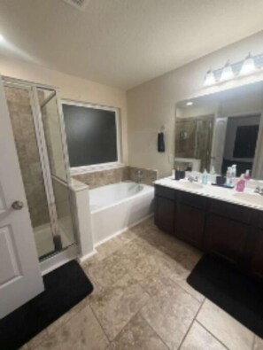 Shower, towels, soap, toilet paper - Cozy Elegance • Comfortable Home in Quiet Tomball (Tomball)