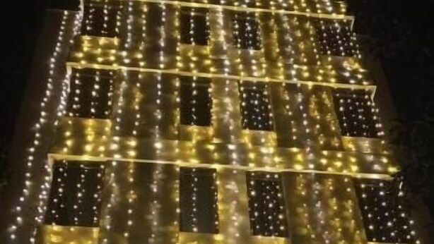 A building with a sign reading "Samarth Elite" illuminated by string lights. - Hotel Samarth Elite Baner (Pune)