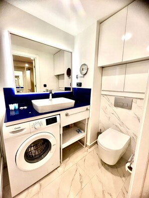 Hair dryer, towels, soap, toilet paper - Modern Sea-View Studio in Orbi City Batumi | Steps from the Beach (Batumi)