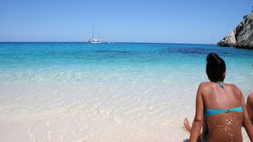 On the beach, sun loungers, beach towels