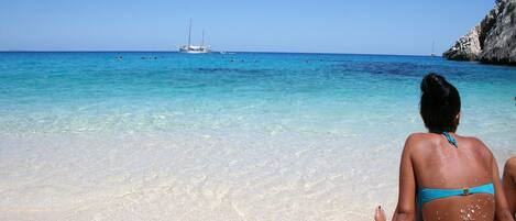 On the beach, sun loungers, beach towels