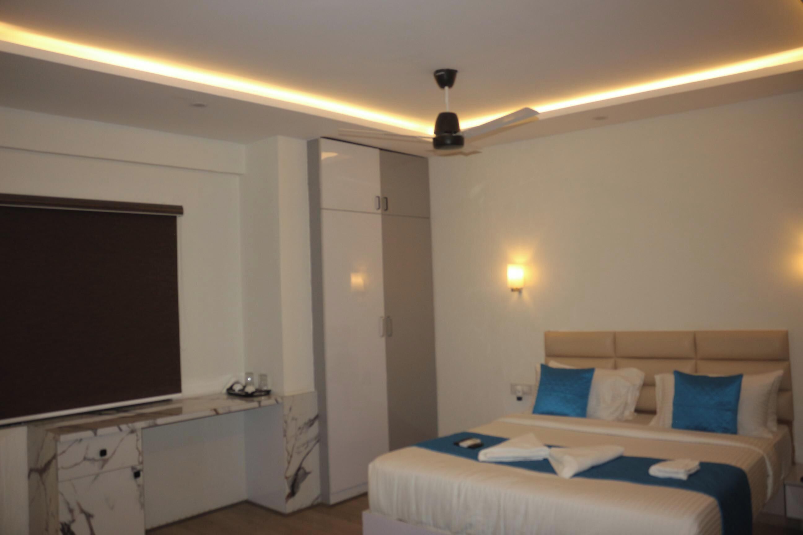 Desk, laptop workspace, blackout drapes, iron/ironing board