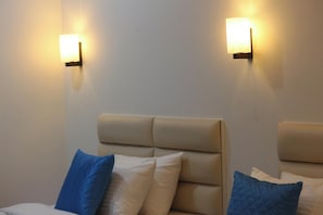 Premium bedding, down duvets, desk, laptop workspace - Niharika Heights Luxury Hotel (Bengaluru)