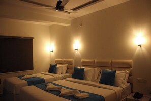 Family Room | Desk, laptop workspace, blackout drapes, iron/ironing board - Niharika Heights Luxury Hotel (Bengaluru)