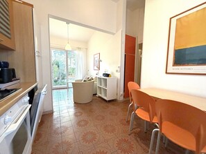 Villa, 2 Bedrooms, Patio, Garden View | Dining room - Bright Villa With a Fenced Garden Near the Beach (San Michele al Tagliamento)