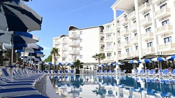 Outdoor pool, open 9:00 AM to 10:00 PM, pool umbrellas