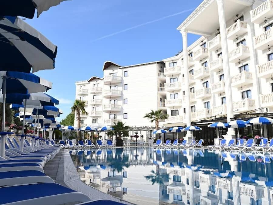Outdoor pool, open 9:00 AM to 10:00 PM, pool umbrellas